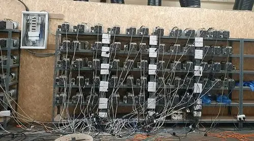 A bustling mining farm hosting various rigs, illustrating the scale and efficiency of professional crypto operations