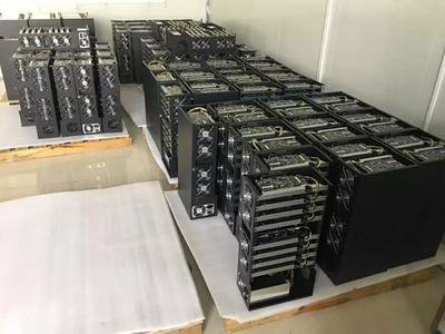 A busy mining farm with multiple rigs